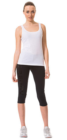 Outfit composed of tank top and corsair-style trousers in stretch cotton